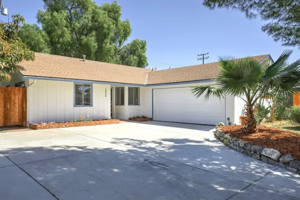 a house with yard in front of it