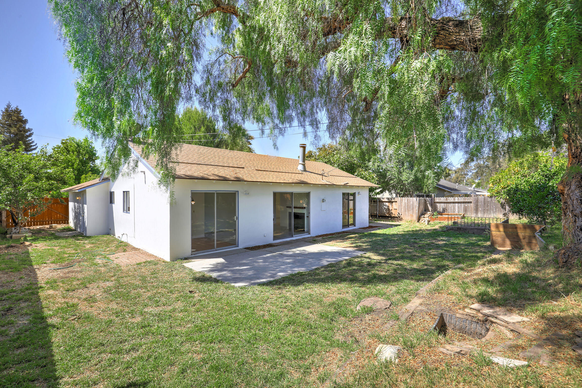 5058 Rocoso Way Santa Barbara, CA 93111 - Photo 16 of 19 a view of a house with yard and garden