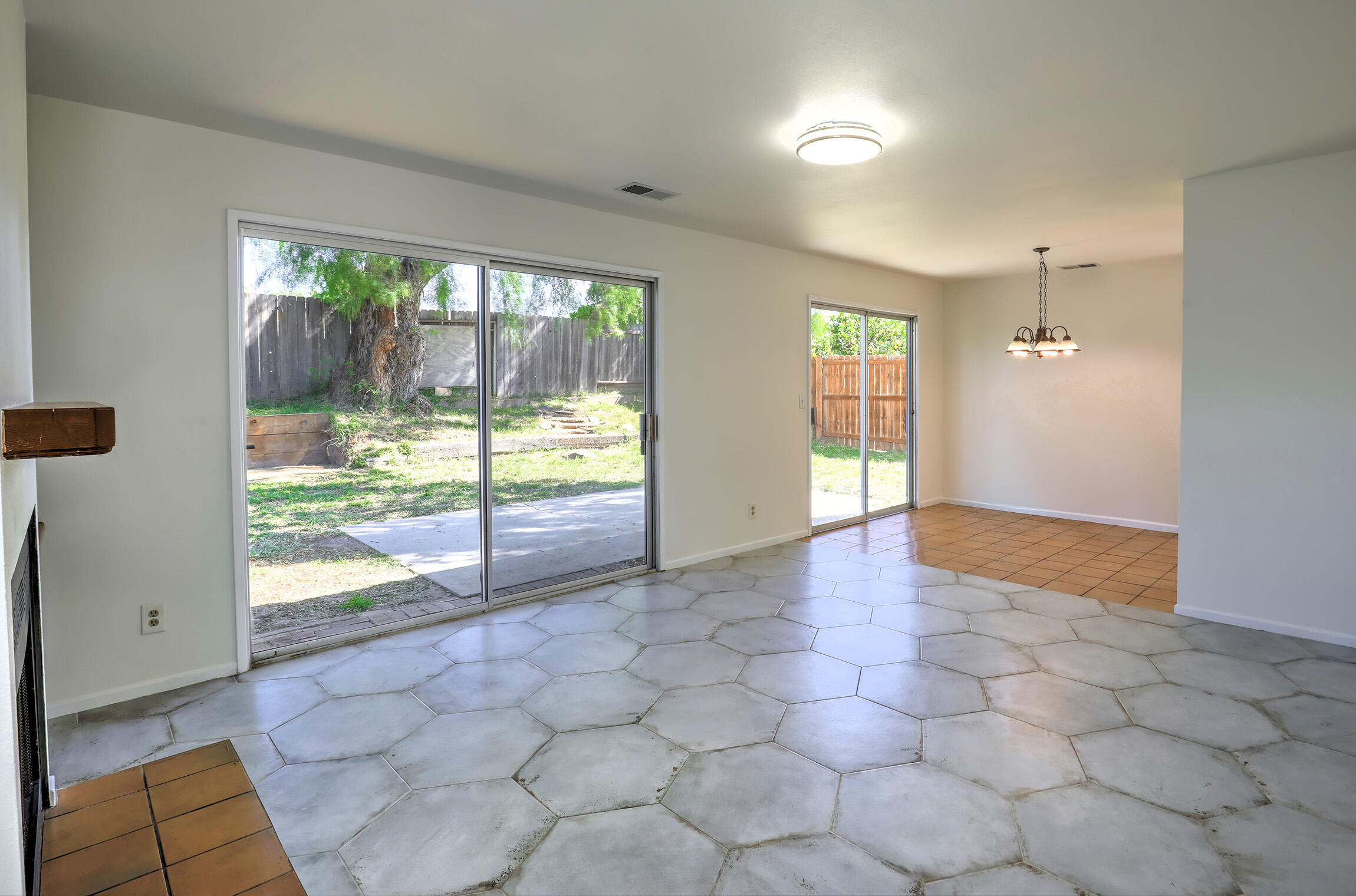 5058 Rocoso Way Santa Barbara, CA 93111 - Photo 3 of 19 an empty room with floor to ceiling windows and a flat screen tv