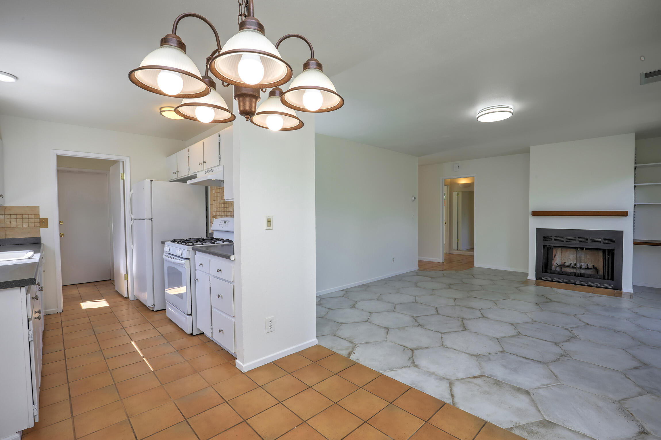 5058 Rocoso Way Santa Barbara, CA 93111 - Photo 7 of 19 a view of a kitchen with a chandelier and refrigerator