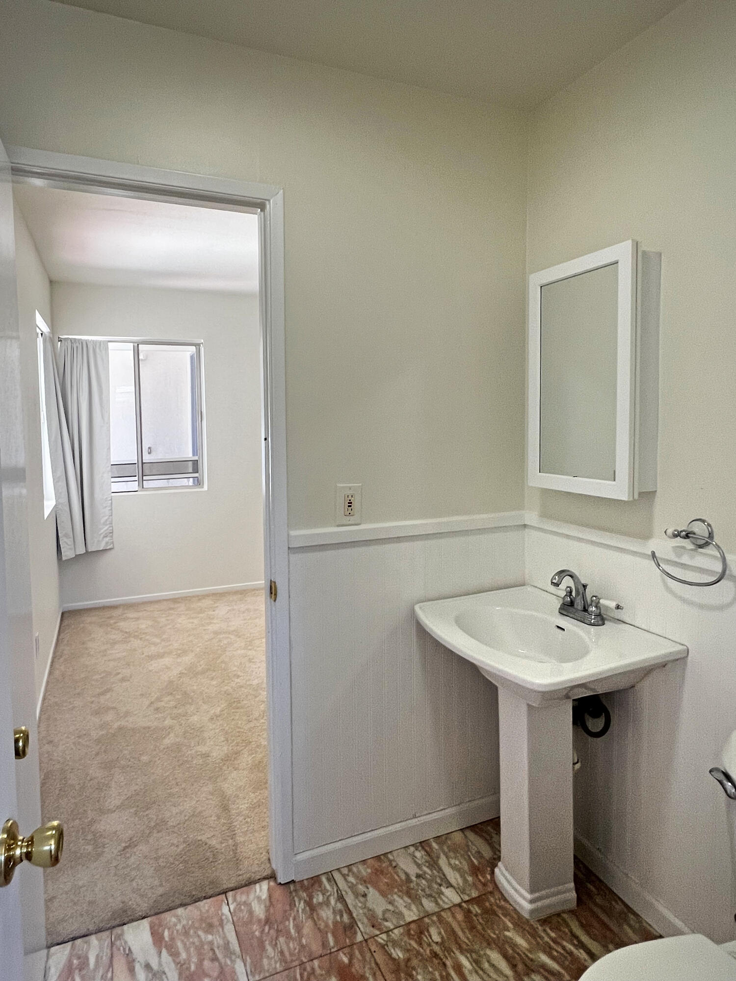5058 Rocoso Way Santa Barbara, CA 93111 - Photo 10 of 19 a bathroom with a sink and a mirror