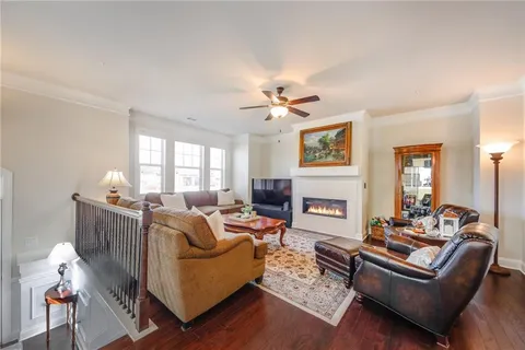 a living room with furniture fireplace and window