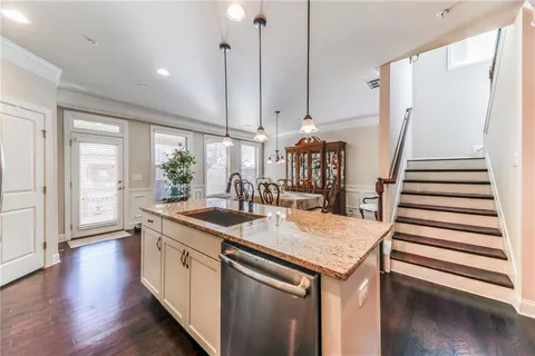 a kitchen with sink and cabinets