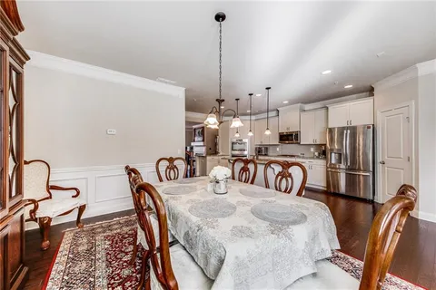 a bedroom with furniture and a chandelier