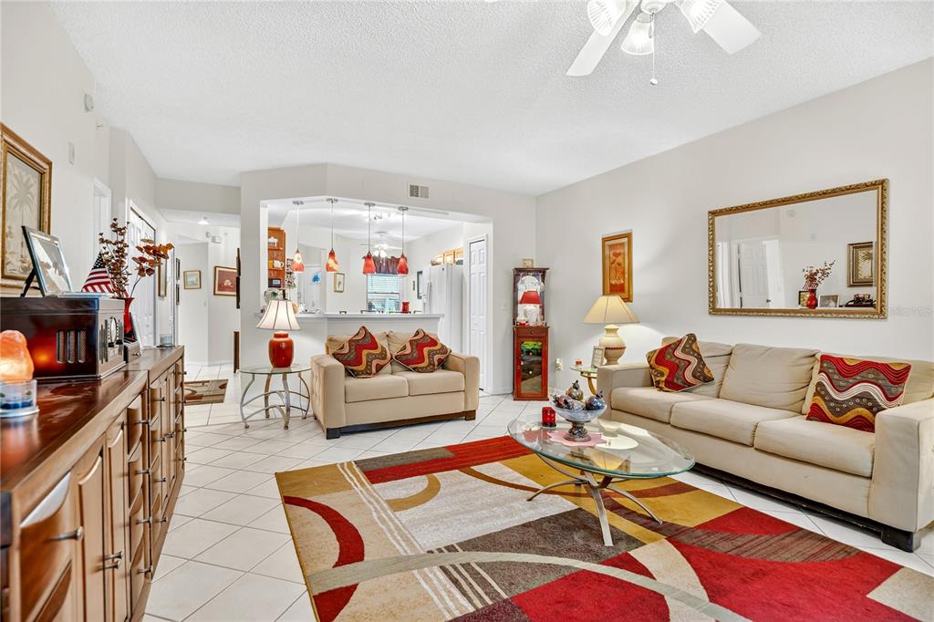 550 Cranes Way, Unit 122 Altamonte Springs, FL 32701 - Photo 4 of 26 a living room with furniture a rug and a flat screen tv
