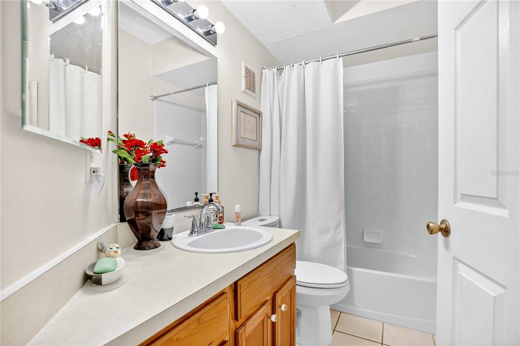 550 Cranes Way, Unit 122 Altamonte Springs, FL 32701 - Photo 10 of 26 a bathroom with a granite countertop sink toilet and shower