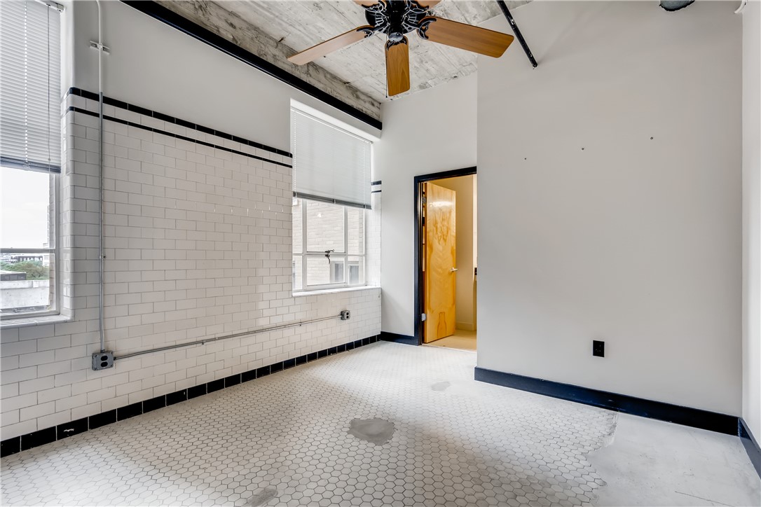 710 Colorado Street, Unit 4J Austin, TX 78701 - Photo 18 of 37 Historic vintage tile wall. 2 huge operable windows.