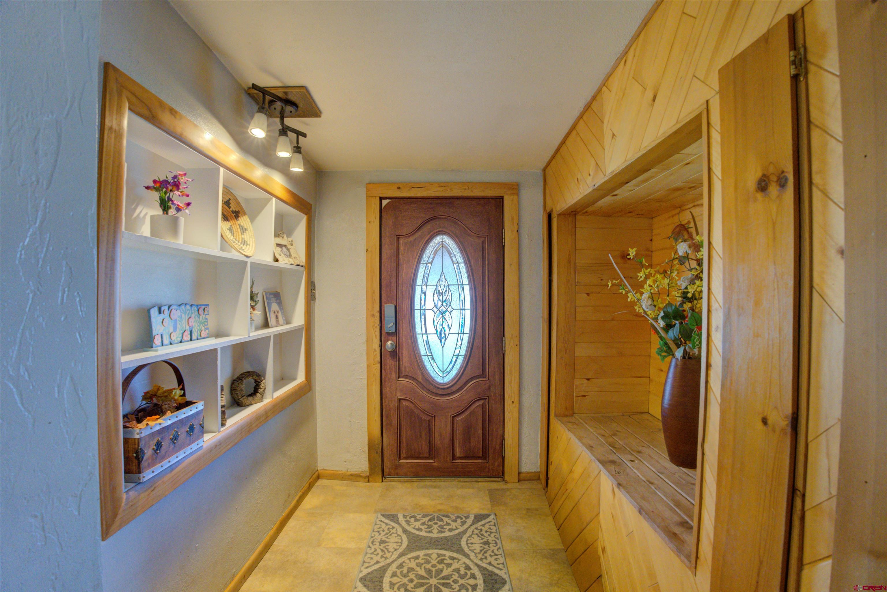 317 South Chestnut Street Cortez, CO 81321 - Photo 4 of 32 a view of an entryway with wooden floor