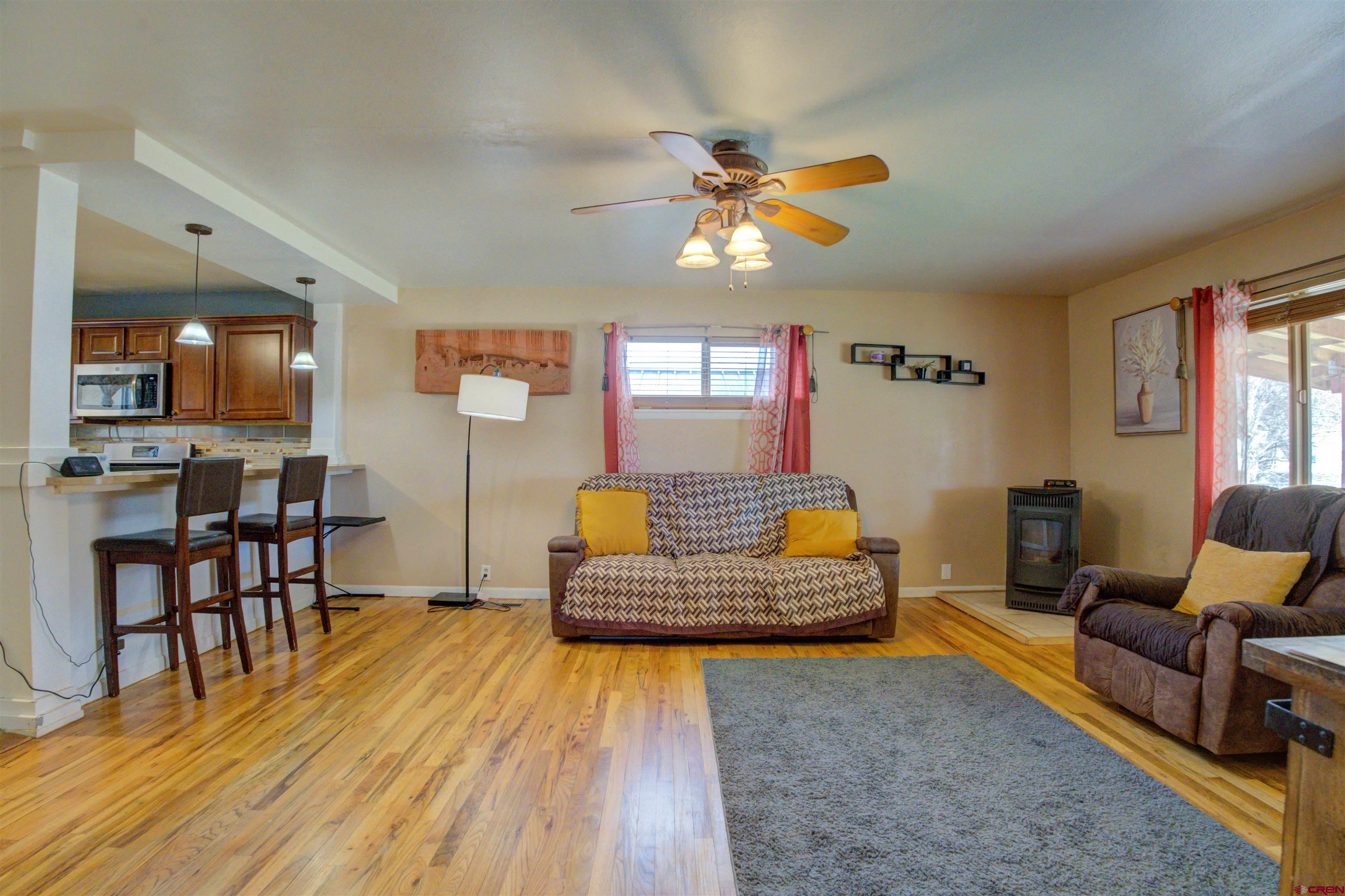 317 South Chestnut Street Cortez, CO 81321 - Photo 8 of 32 a living room with furniture and wooden floor