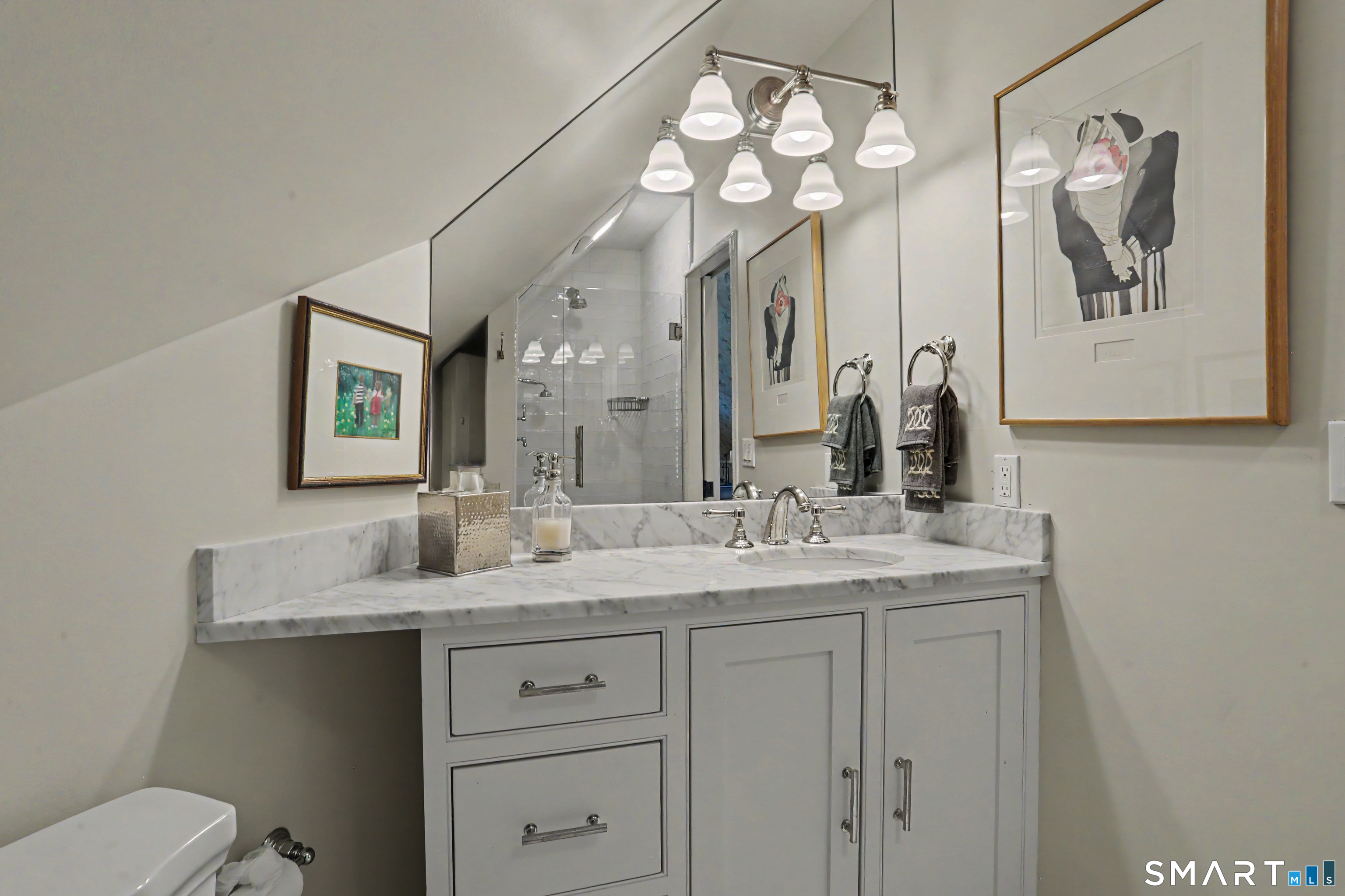 36 Catoonah Street, Unit 18 Ridgefield, CT 06877 - Photo 29 of 40 a bathroom with a granite countertop sink a toilet and a mirror