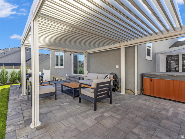 882 Spring Dew Lane Lehi, UT 84048 - Photo 15 of 46 View of patio / terrace with an outdoor lounge area, a pergola, and a hot tub