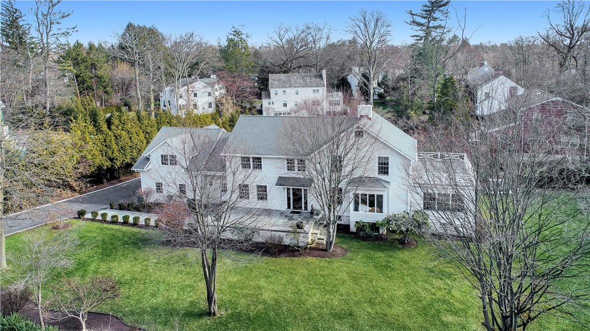 Welcome to 2 Obry Drive nestled on a beautiful private cul-de-sac in Scarsdale's sought-after Heathcote neighborhood.