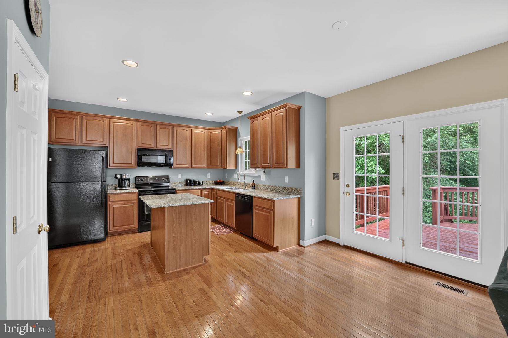 9957 Guilford Road Jessup, MD 20794 - Photo 13 of 37 Kitchen with French Doors leads to Rear Deck