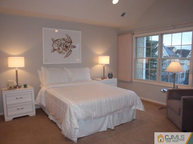 41 Raritan Reach Road, Unit 21 South Amboy, NJ 08879 - Photo 12 of 23 a bedroom with a bed and a window
