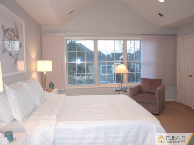 41 Raritan Reach Road, Unit 21 South Amboy, NJ 08879 - Photo 13 of 23 a bedroom with a bed and a window