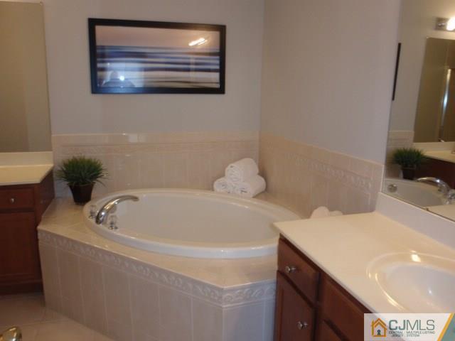 41 Raritan Reach Road, Unit 21 South Amboy, NJ 08879 - Photo 14 of 23 a bathroom with a bathtub and a sink