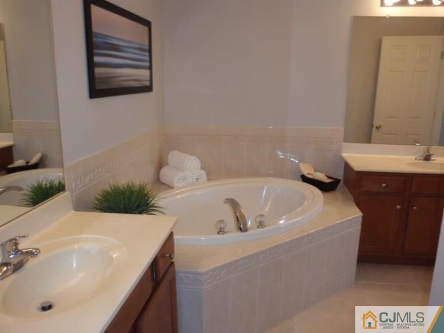 41 Raritan Reach Road, Unit 21 South Amboy, NJ 08879 - Photo 15 of 23 a bathroom with a sink and a bathtub
