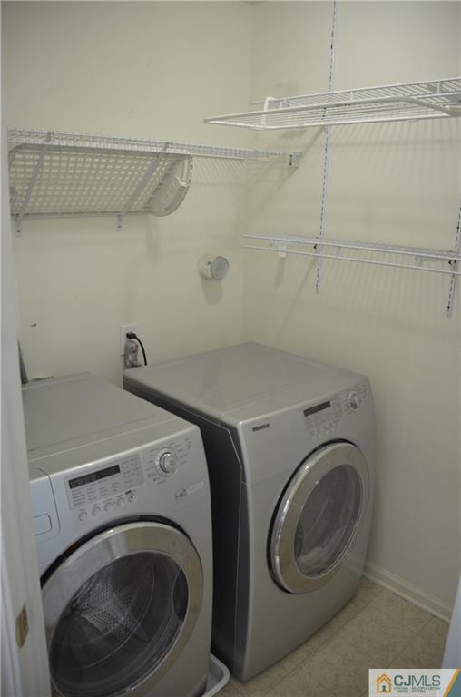 41 Raritan Reach Road, Unit 21 South Amboy, NJ 08879 - Photo 16 of 23 a utility room with dryer and washer