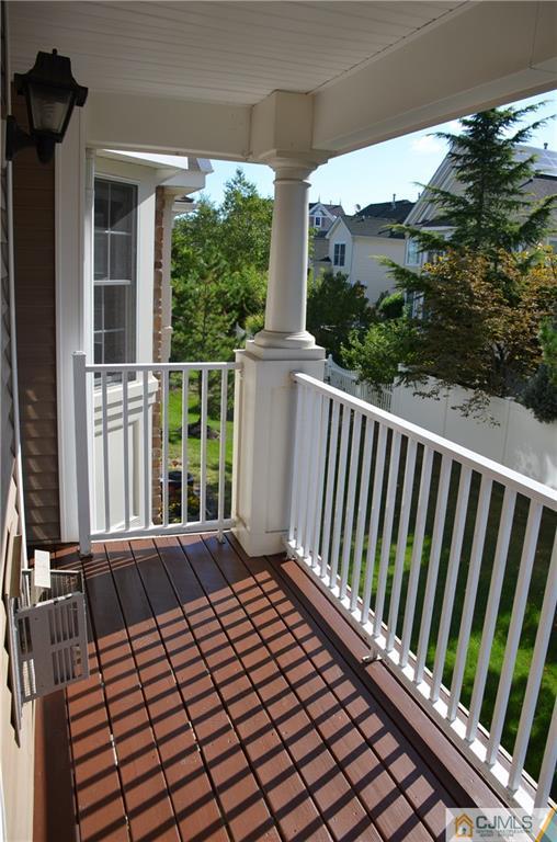 41 Raritan Reach Road, Unit 21 South Amboy, NJ 08879 - Photo 19 of 23 a view of balcony with wooden floor