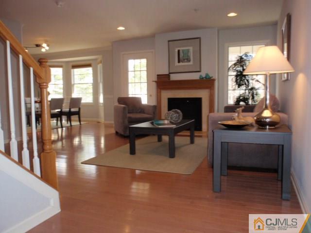41 Raritan Reach Road, Unit 21 South Amboy, NJ 08879 - Photo 3 of 23 a living room with furniture and a fireplace