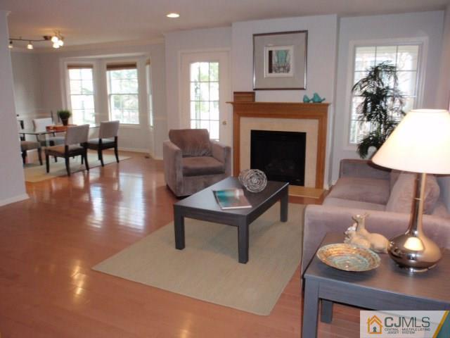41 Raritan Reach Road, Unit 21 South Amboy, NJ 08879 - Photo 4 of 23 a living room with furniture and a fireplace