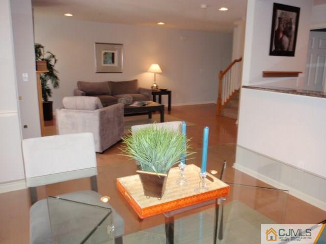 41 Raritan Reach Road, Unit 21 South Amboy, NJ 08879 - Photo 5 of 23 a living room with furniture and wooden floor