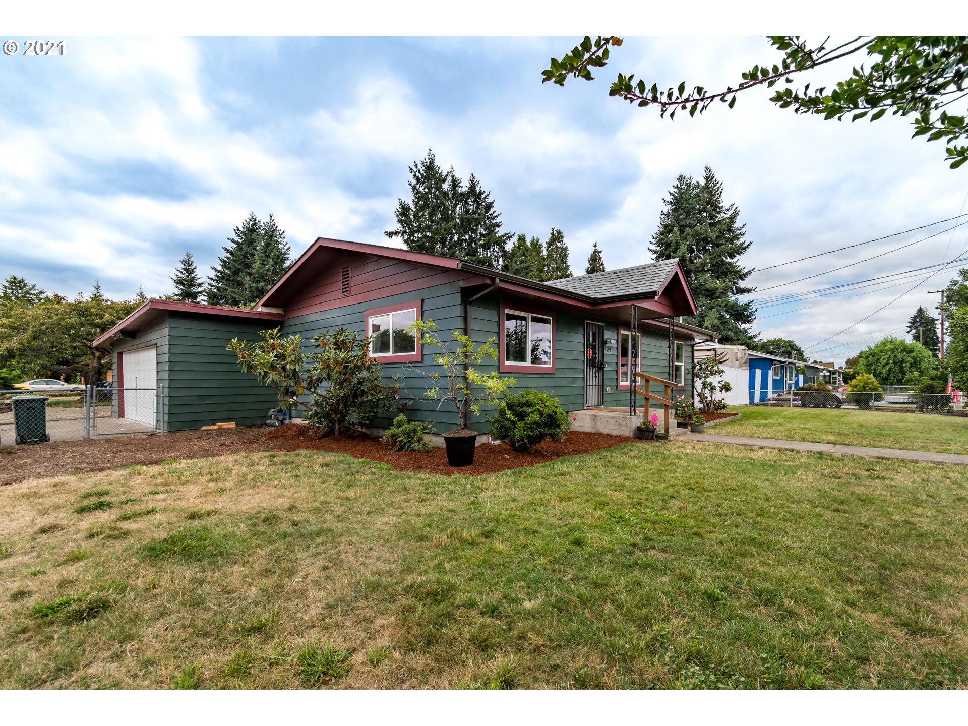 5195 E Street Springfield, OR 97478 - Photo 2 of 30 a front view of a house with yard and green space