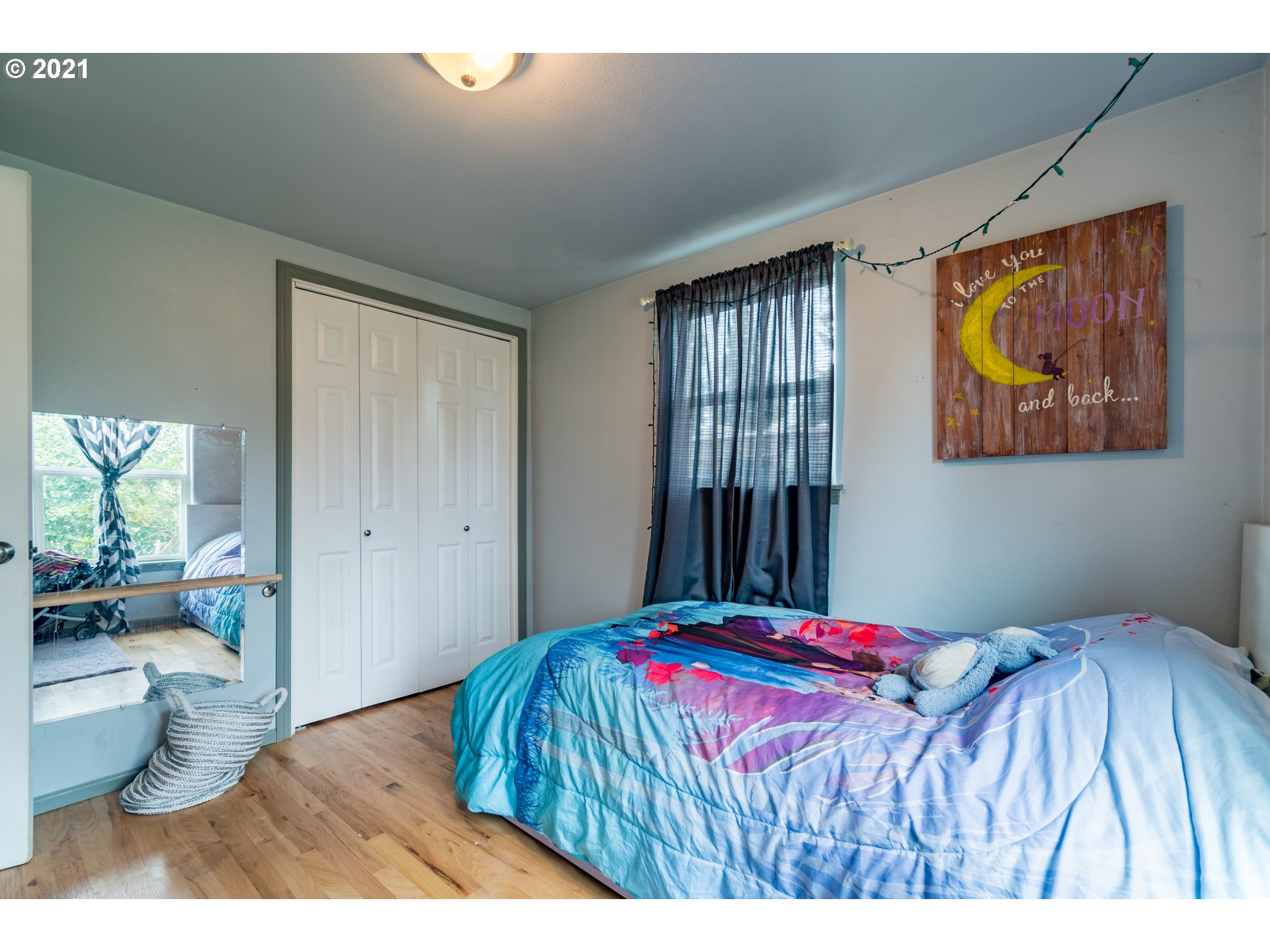 5195 E Street Springfield, OR 97478 - Photo 16 of 30 a bedroom with a bed and a painting on the wall