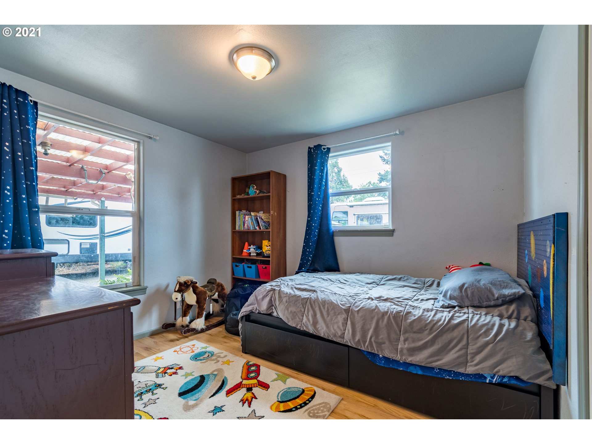 5195 E Street Springfield, OR 97478 - Photo 17 of 30 a bedroom with a bed and a window
