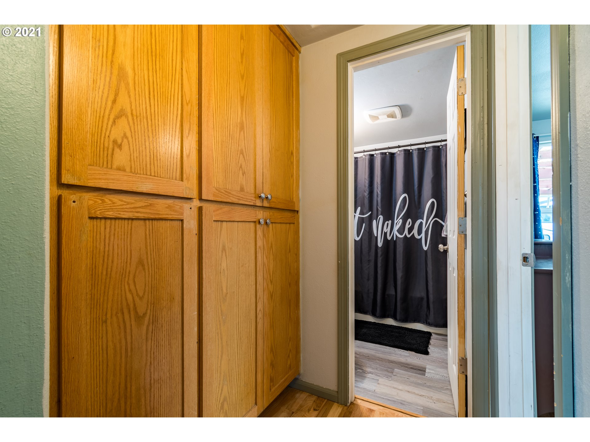 5195 E Street Springfield, OR 97478 - Photo 19 of 30 a view of a bathroom with a shower and a door