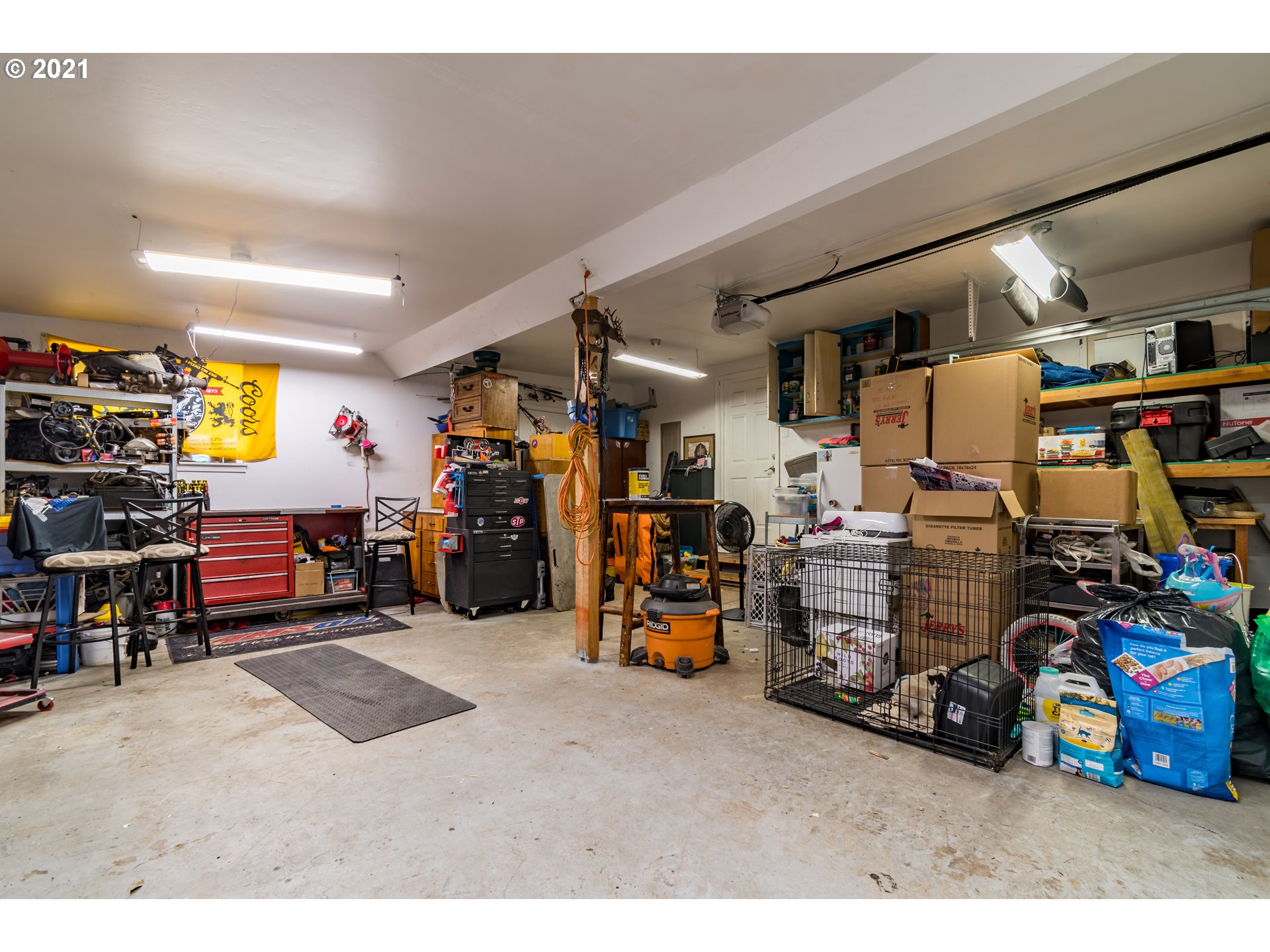 5195 E Street Springfield, OR 97478 - Photo 22 of 30 a garage with a bike and car