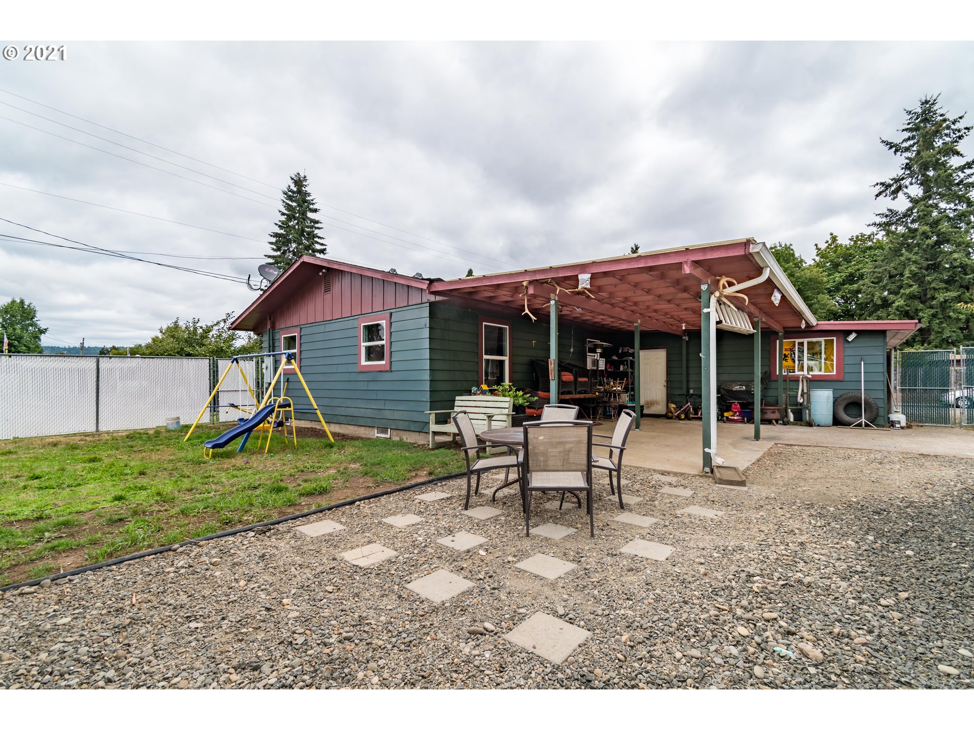 5195 E Street Springfield, OR 97478 - Photo 27 of 30 a view of a house with a yard patio and sitting area