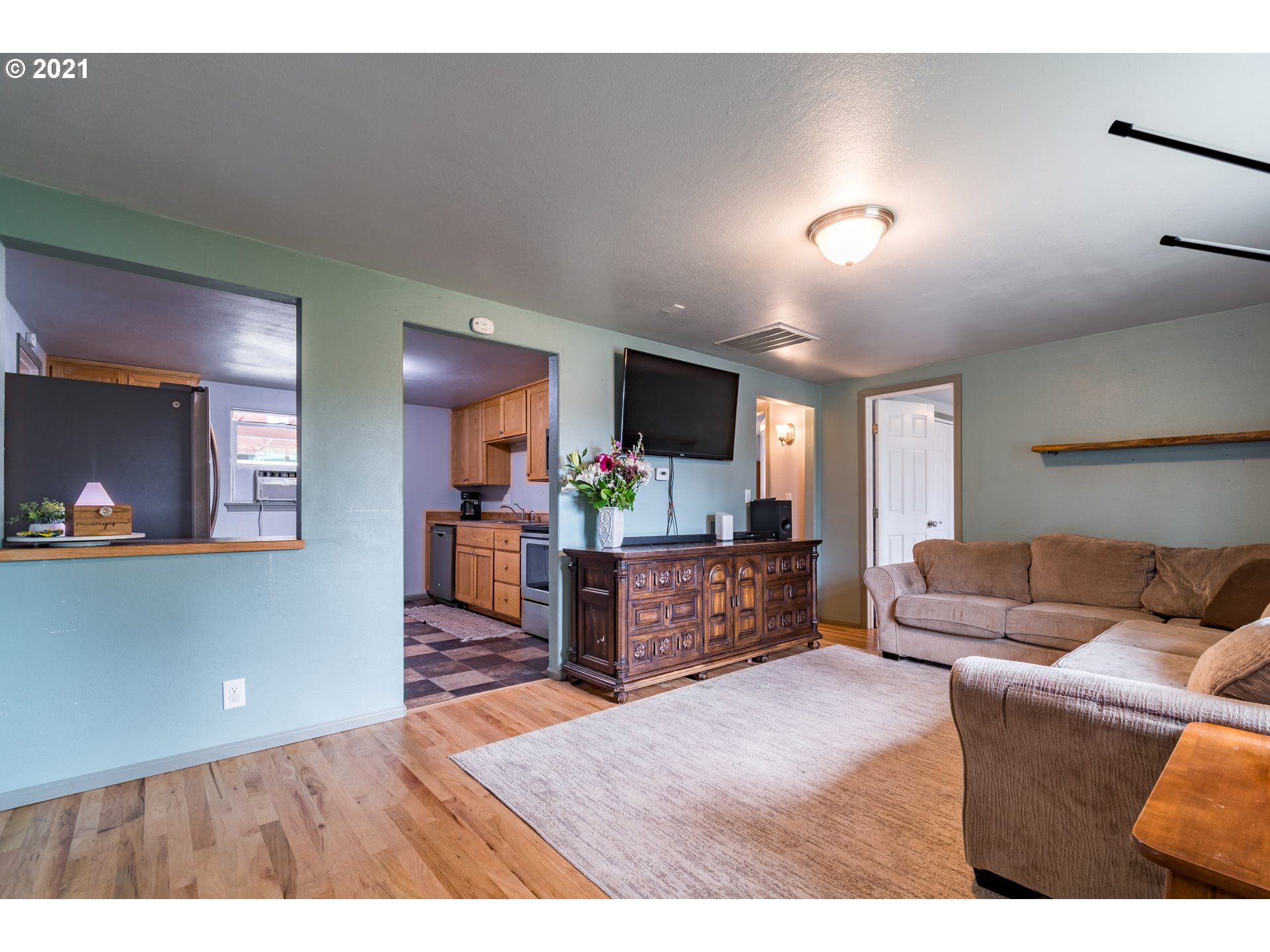 5195 E Street Springfield, OR 97478 - Photo 4 of 30 a living room with furniture and a wooden floor