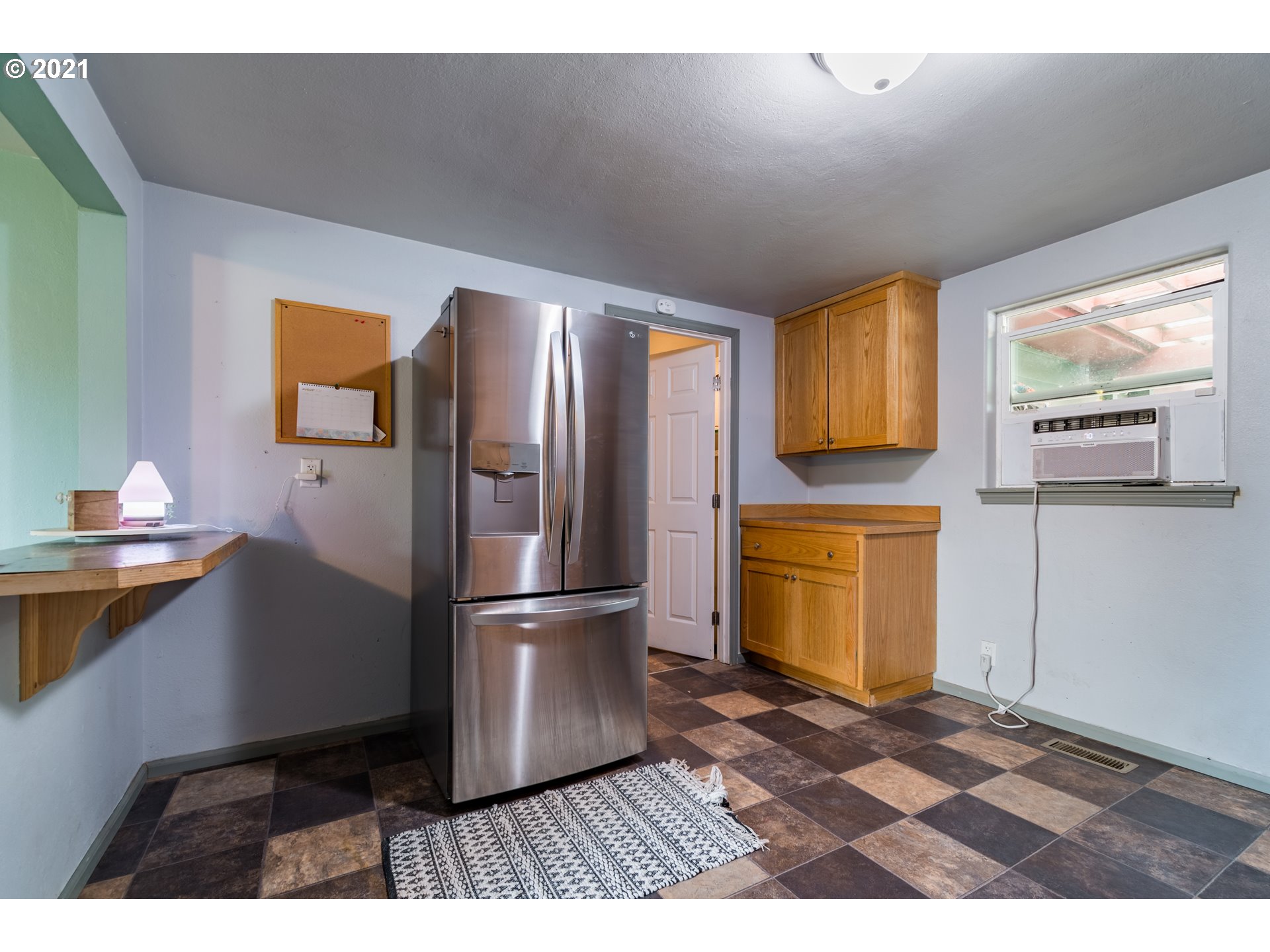 5195 E Street Springfield, OR 97478 - Photo 10 of 30 a kitchen with a refrigerator and a stove top oven