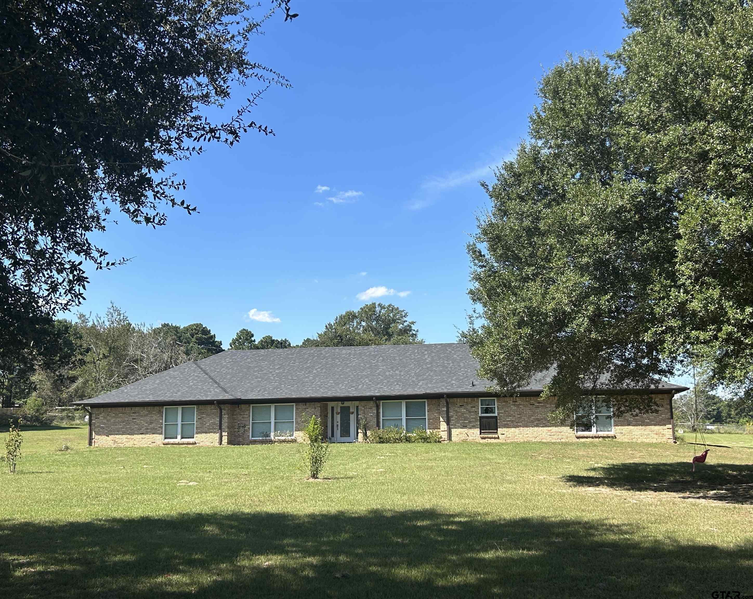 a view of a swimming pool with an outdoor space and seating area