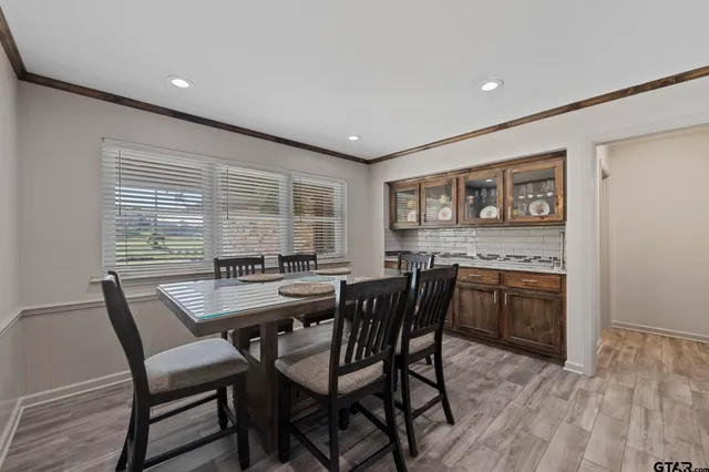 a dining room with furniture and window