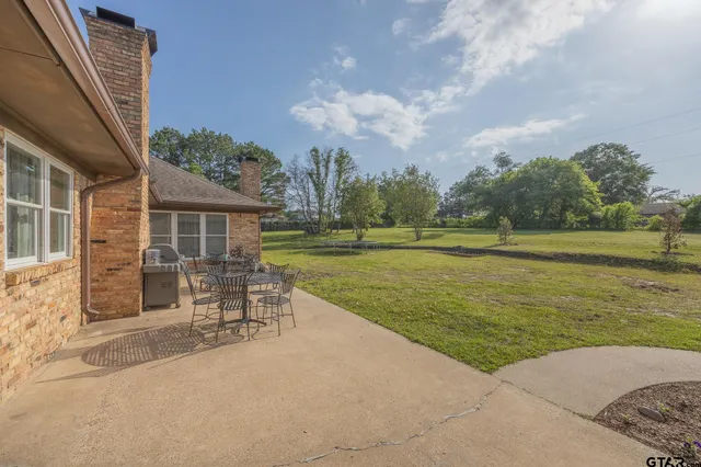 a swimming pool with outdoor seating yard and porch