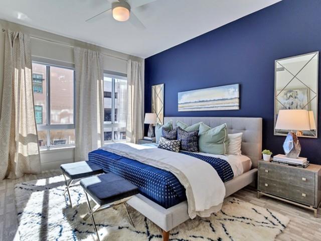 7775 Firefall Way, Unit 2256 Dallas, TX 75230 - Photo 5 of 23 a bedroom with a bed and wooden floor