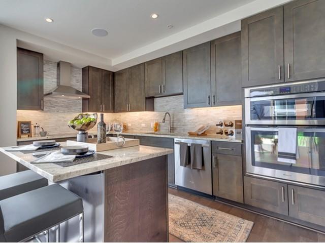 7775 Firefall Way, Unit 2256 Dallas, TX 75230 - Photo 10 of 23 a kitchen with stainless steel appliances granite countertop a sink stove and refrigerator