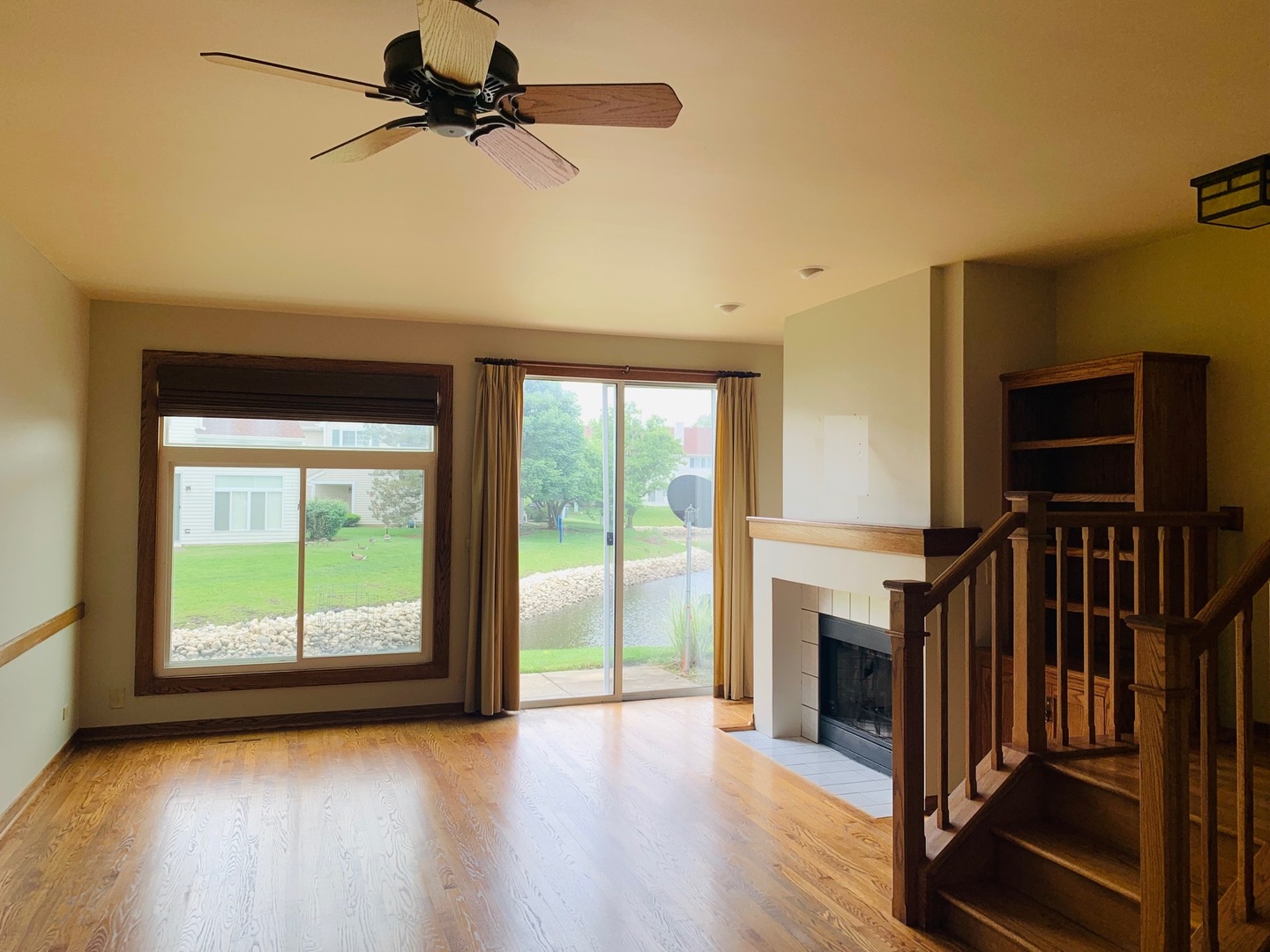 955 Ripple Ridge Cove, Unit 955 Darien, IL 60561 - Photo 5 of 13 a view of empty room with wooden floor and fan