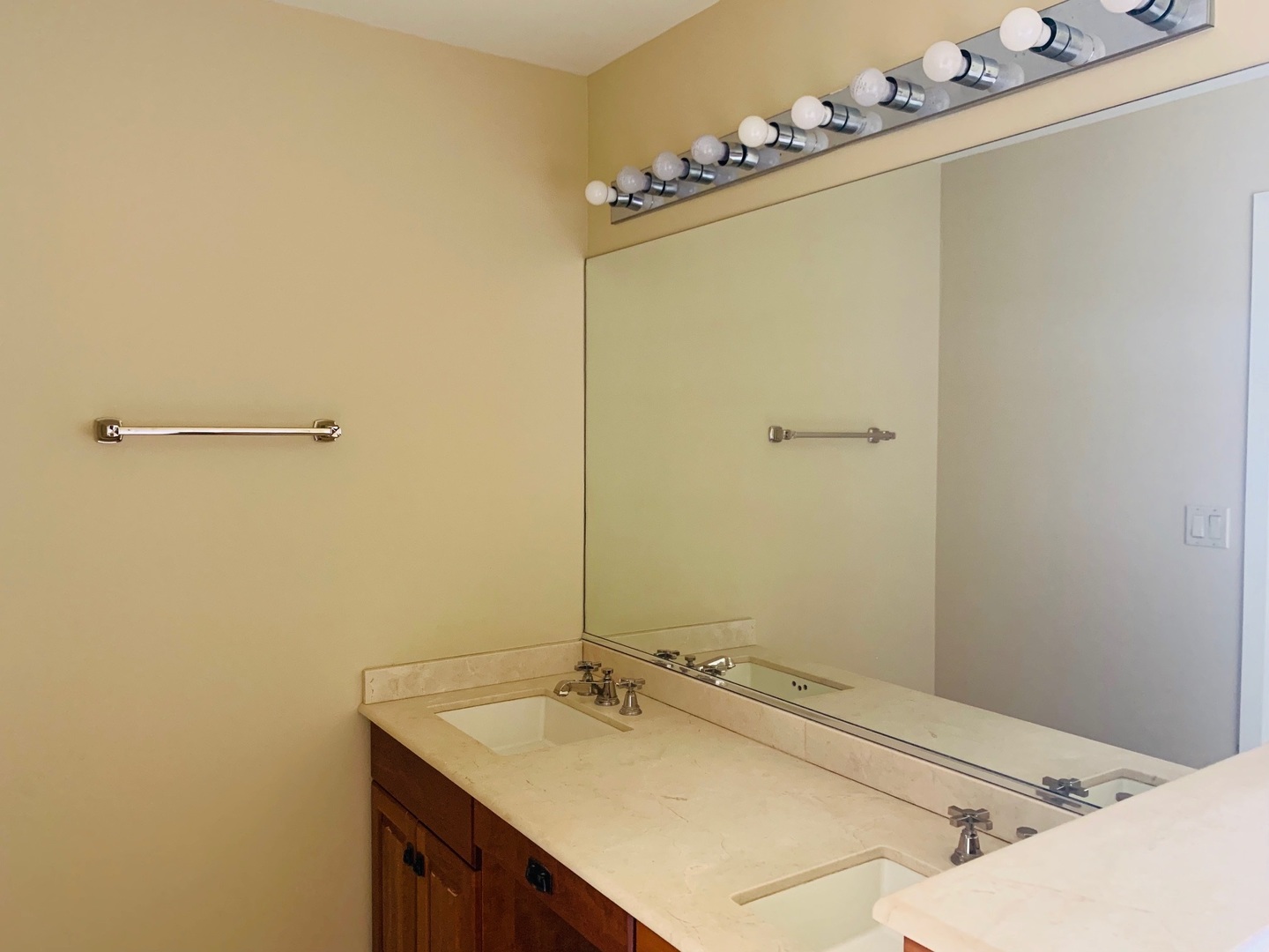 955 Ripple Ridge Cove, Unit 955 Darien, IL 60561 - Photo 10 of 13 a bathroom with a sink and a mirror