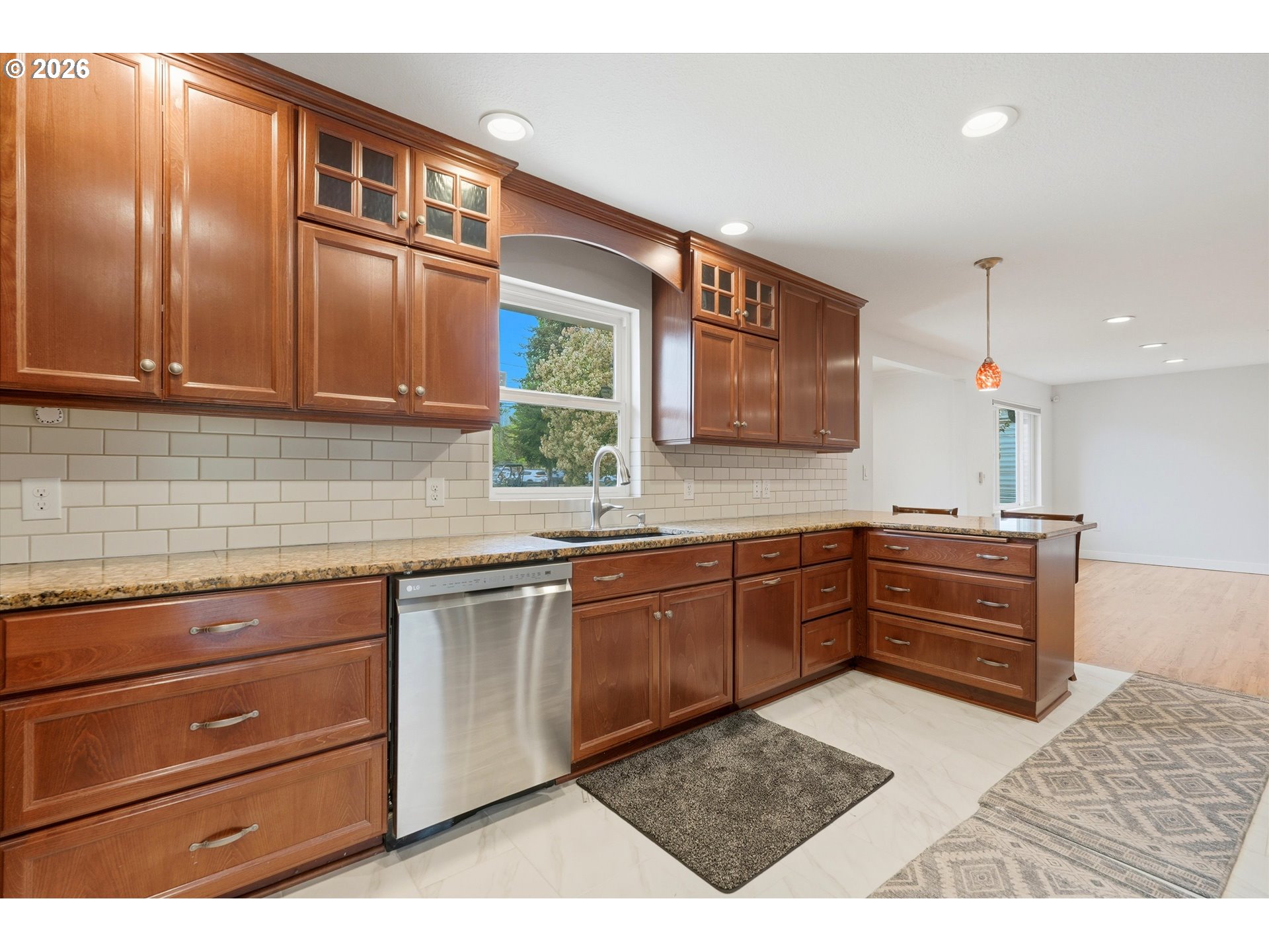 4621 Ohio Street Longview, WA 98632 - Photo 10 of 29 a kitchen with granite countertop wooden cabinets and stainless steel appliances