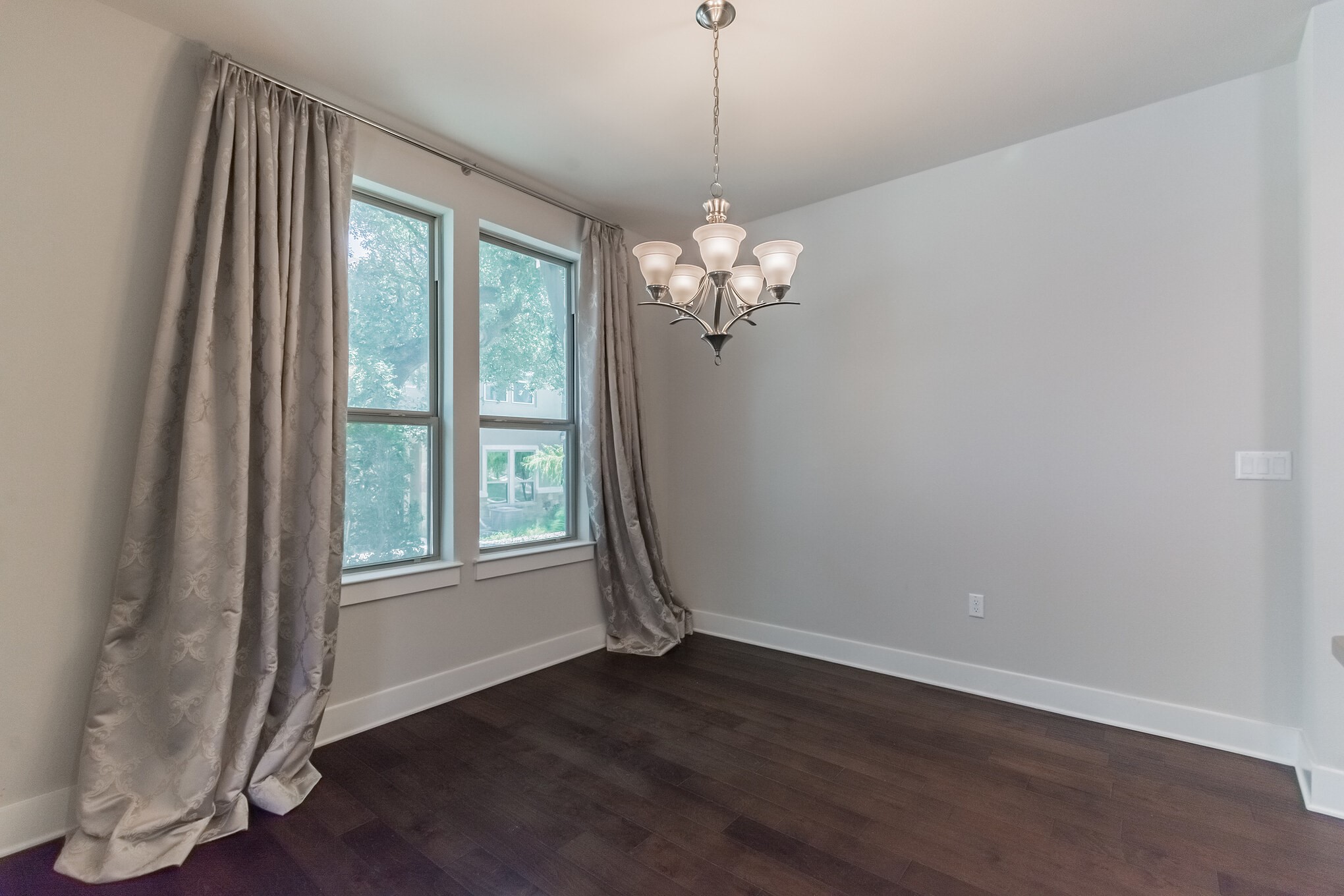 13800 Lyndhurst Street, Unit 221 Austin, TX 78717 - Photo 12 of 40 an empty room with wooden floor and windows