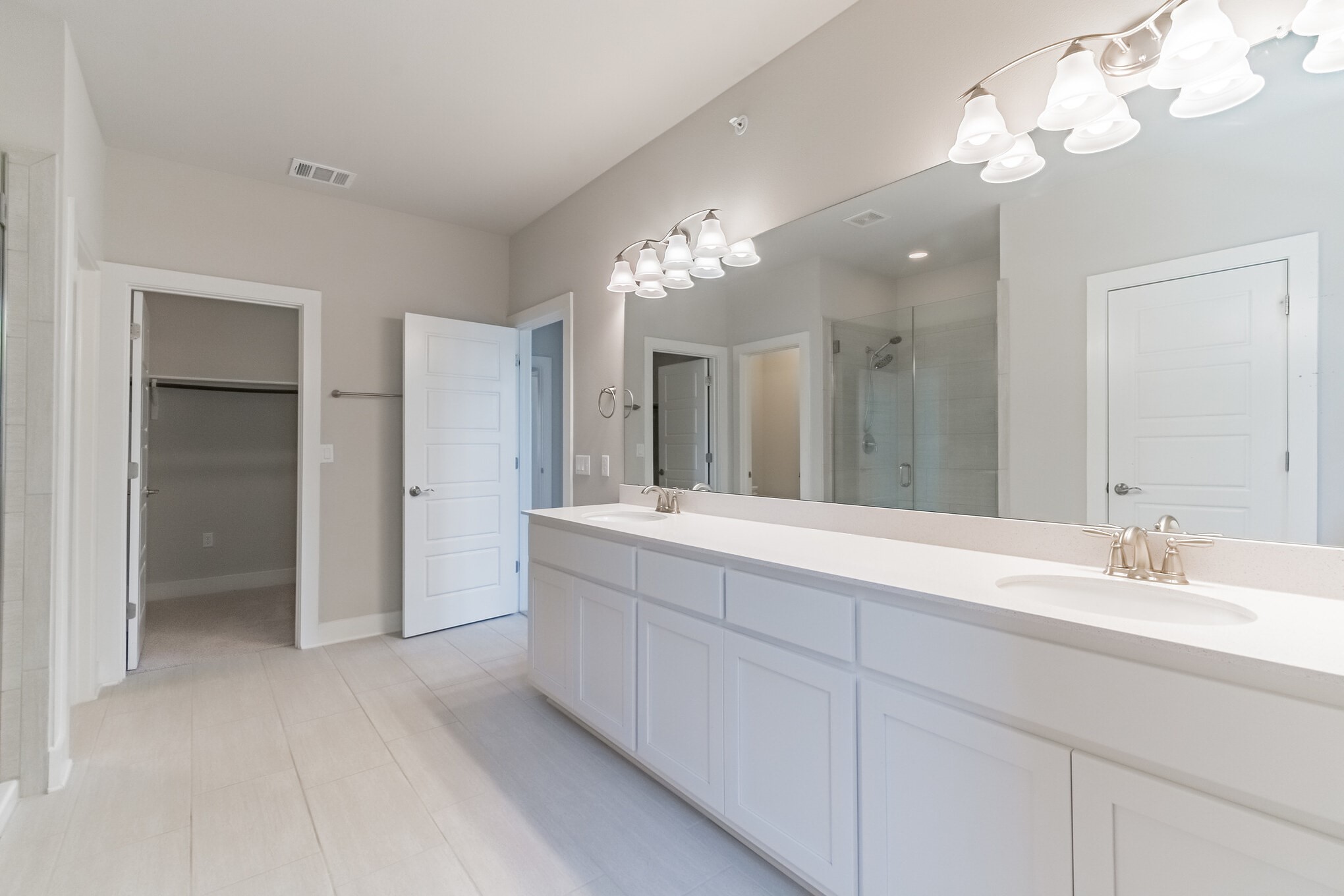 13800 Lyndhurst Street, Unit 221 Austin, TX 78717 - Photo 25 of 40 a spacious bathroom with a double vanity sink mirror and shower