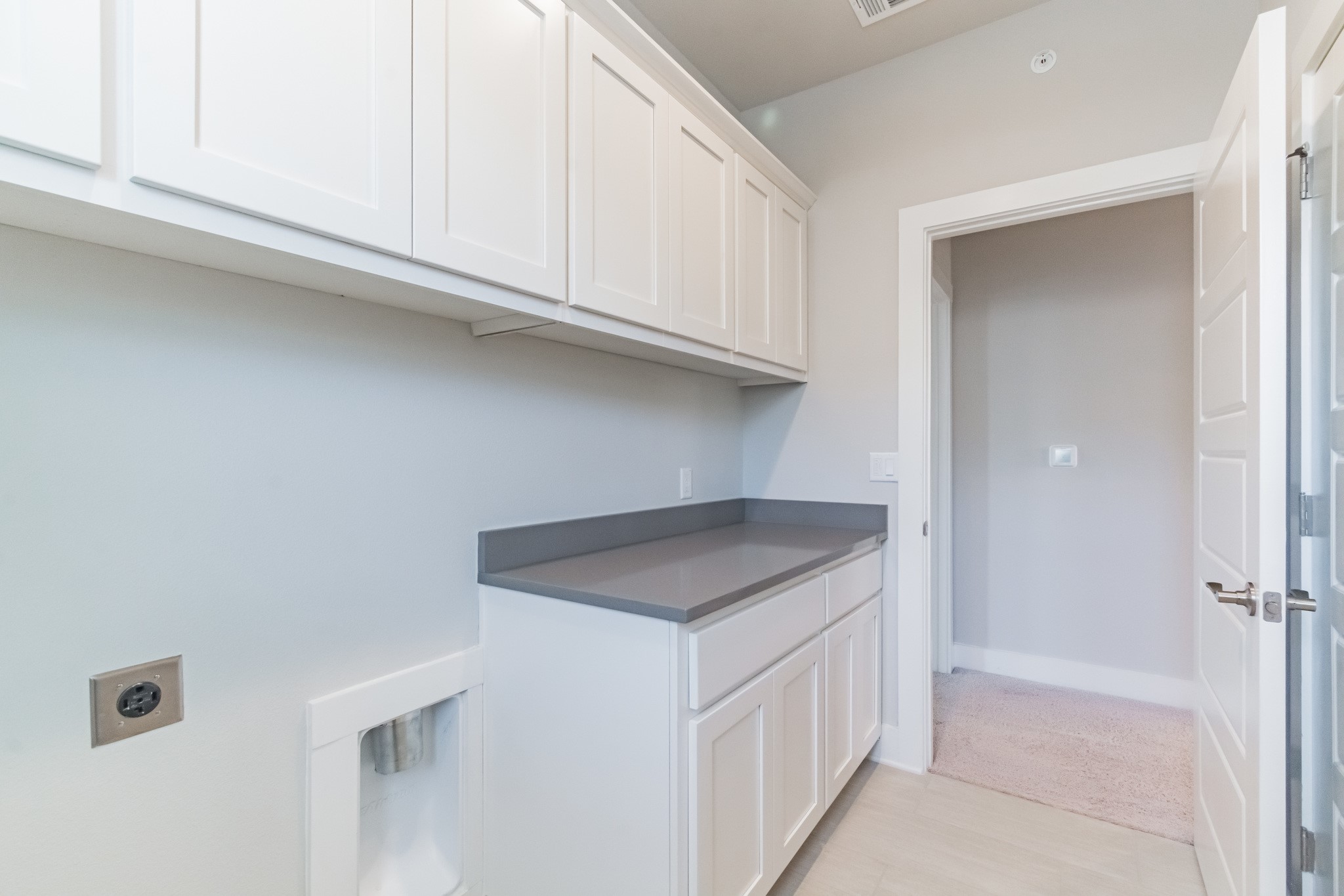 13800 Lyndhurst Street, Unit 221 Austin, TX 78717 - Photo 29 of 40 a kitchen with white cabinets