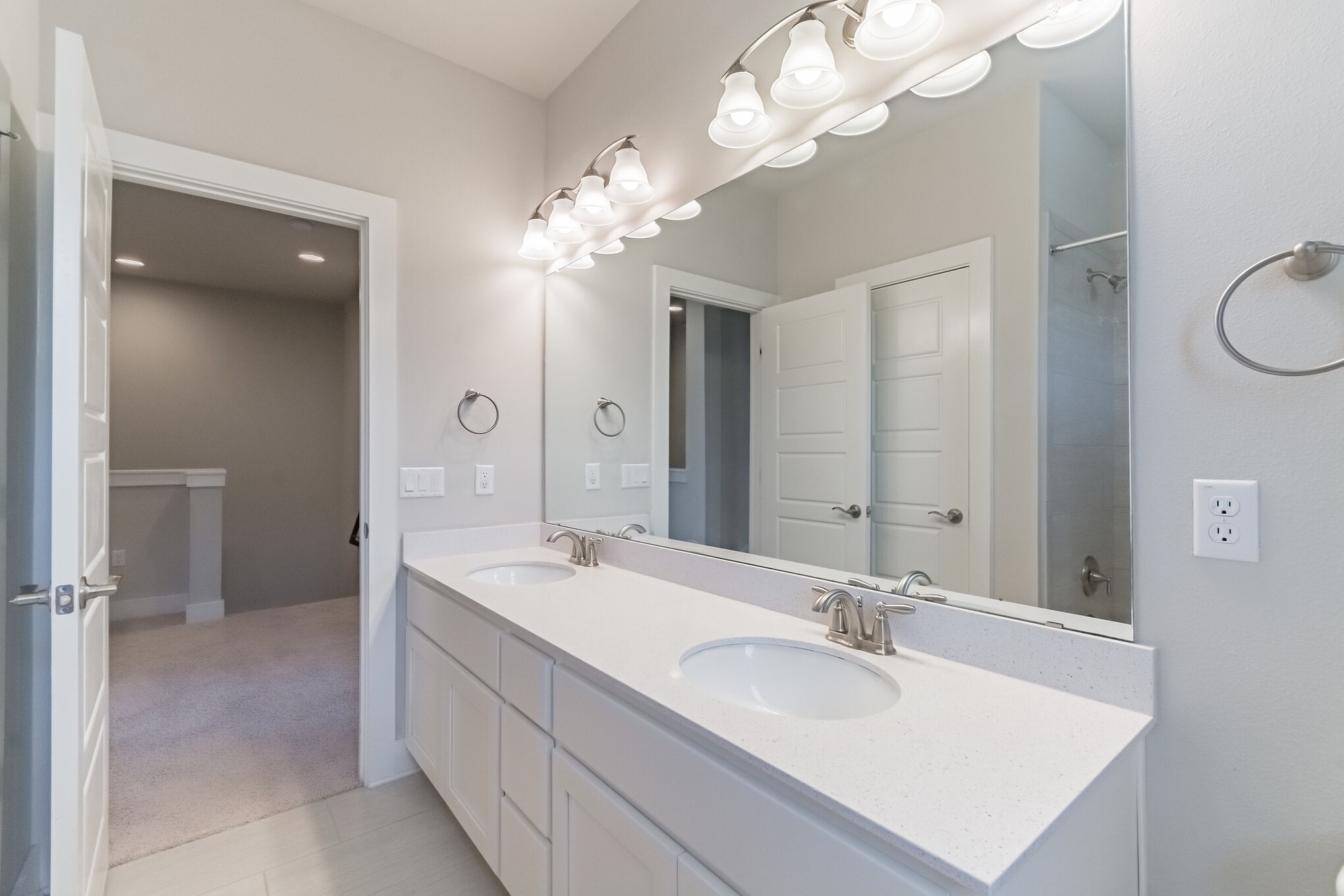 13800 Lyndhurst Street, Unit 221 Austin, TX 78717 - Photo 31 of 40 a spacious bathroom with a sink a toilet and a mirror
