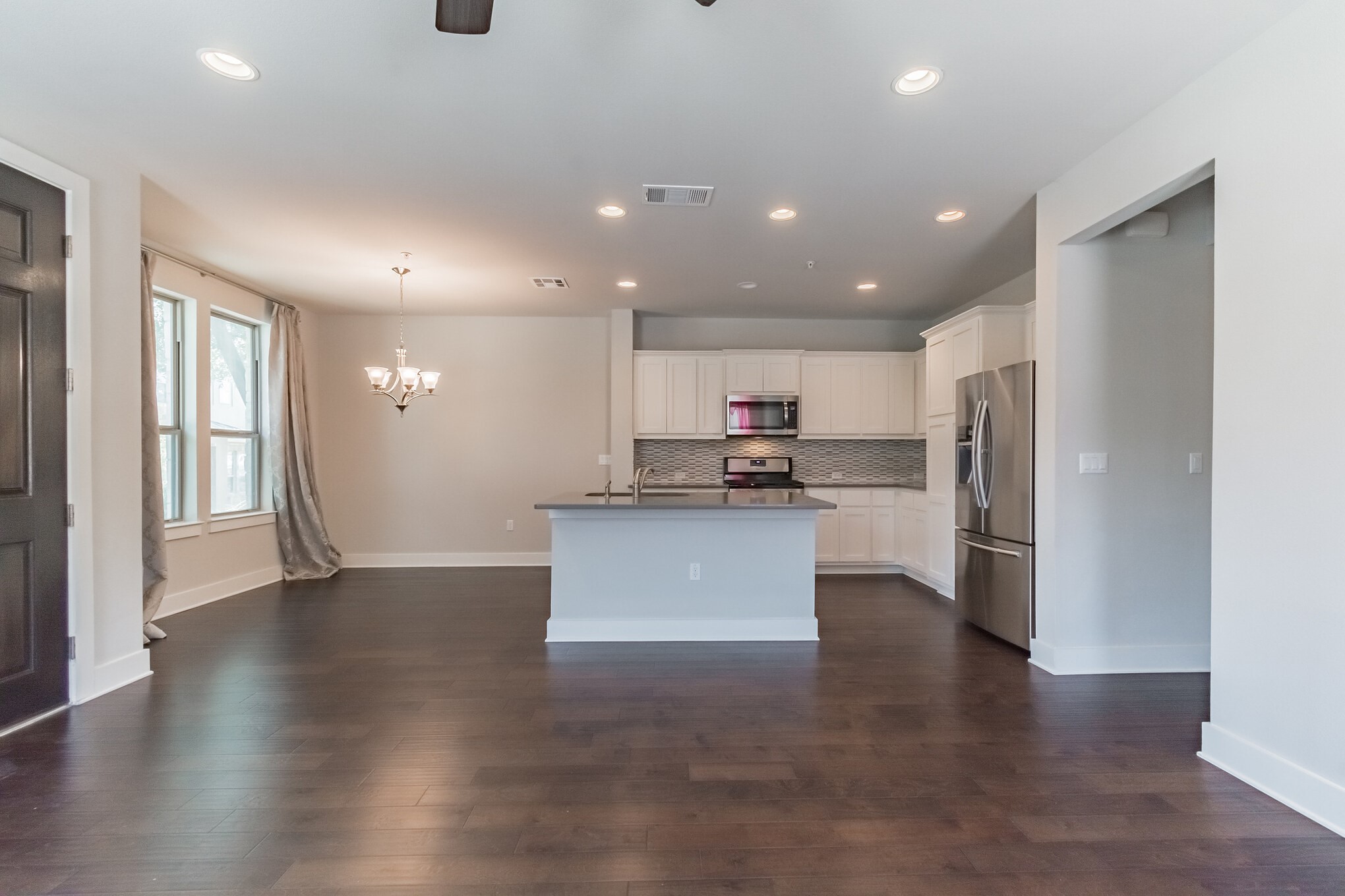 13800 Lyndhurst Street, Unit 221 Austin, TX 78717 - Photo 10 of 40 a view of kitchen with refrigerator stove and wooden floor