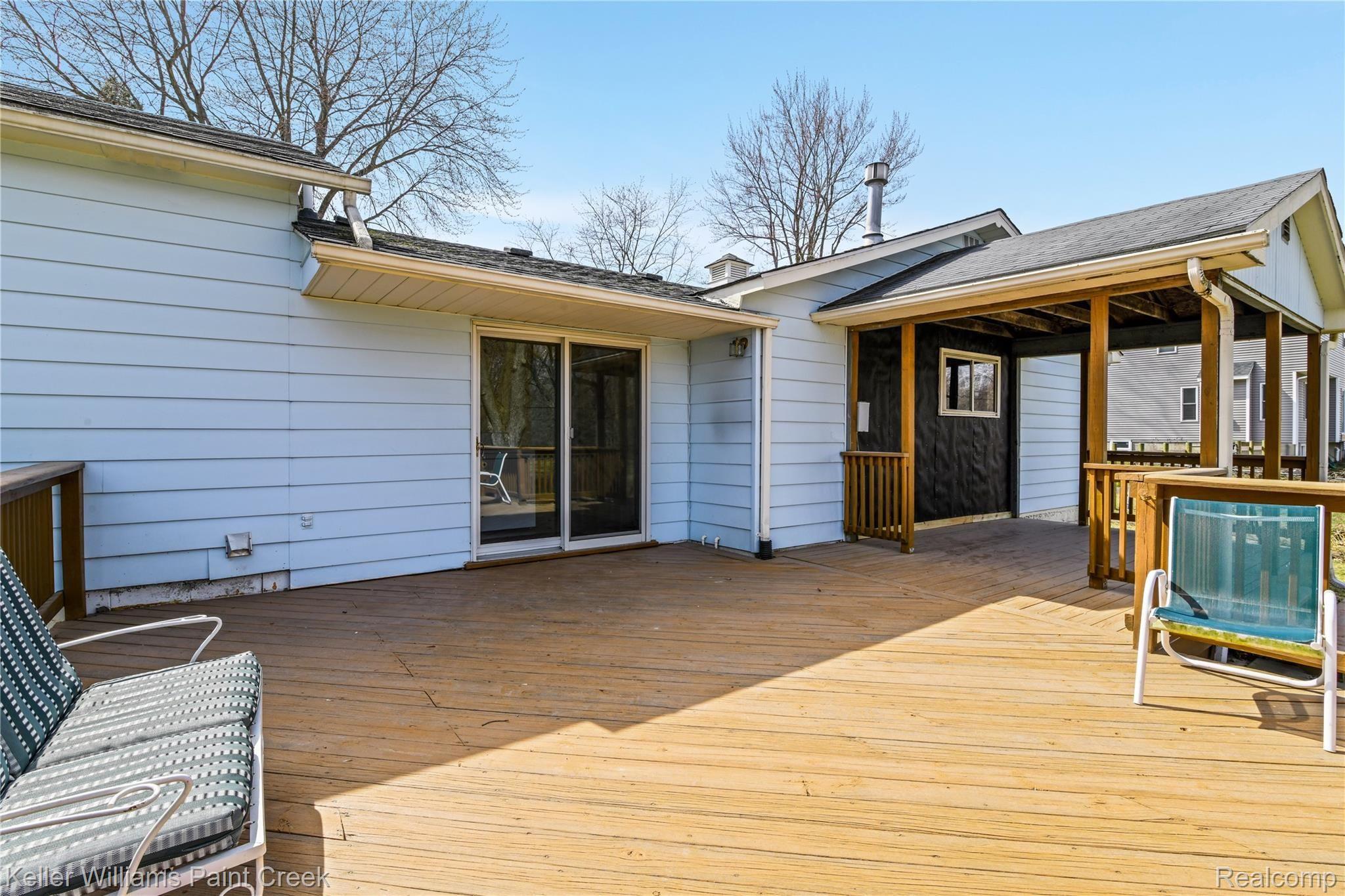 4770 Whipple Lake Road Clarkston, MI 48348 - Photo 17 of 21 Large raised deck is perfect for outdoor entertaining!