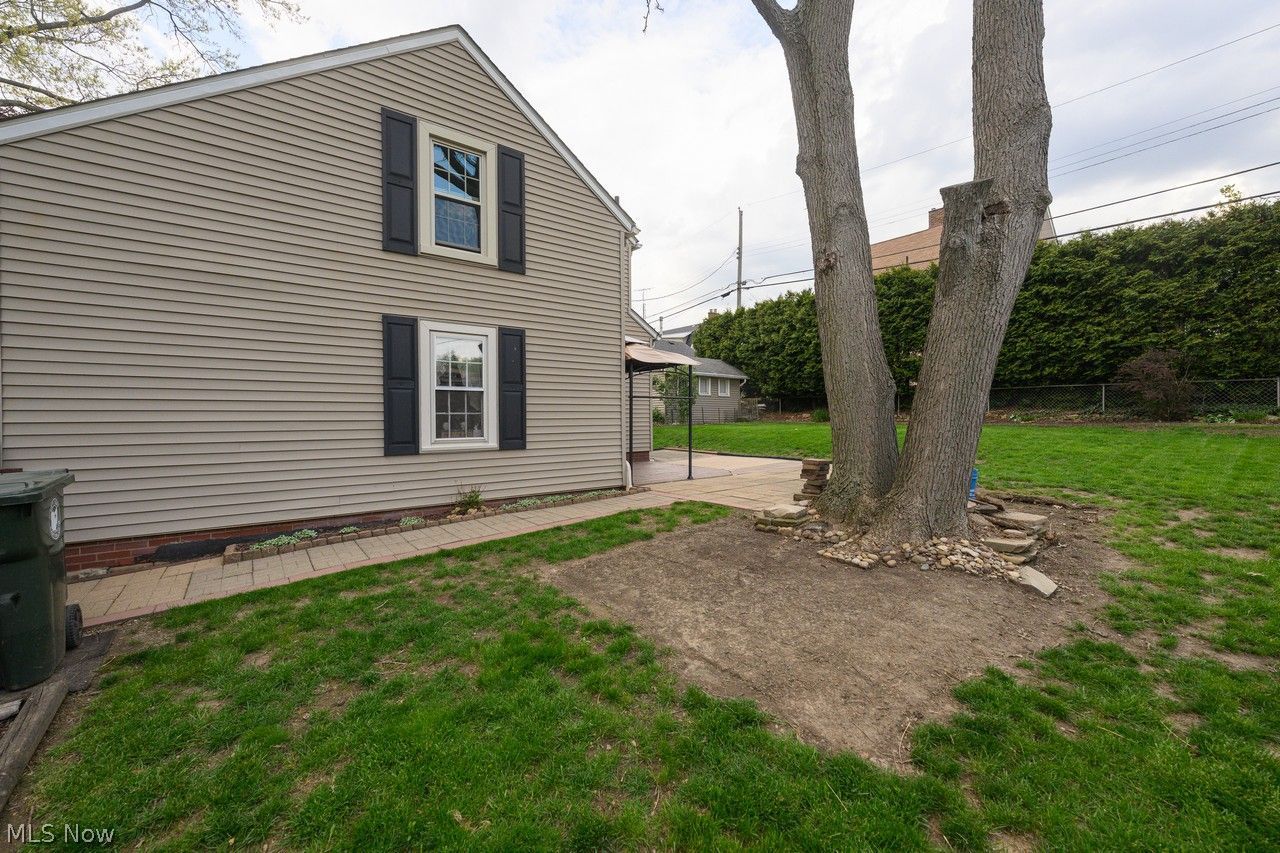 1422 Monument Road Northwest Canton, OH 44703 - Photo 26 of 31 Side of home with walkway to back patio
