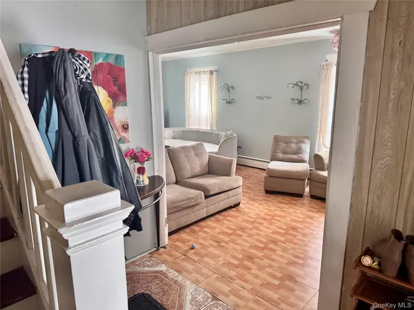 a living room with furniture and a rug